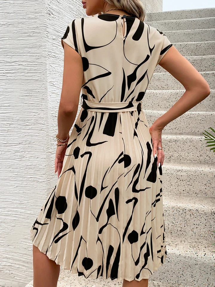 Allaine | Elegant pleated midi dress with waist belt